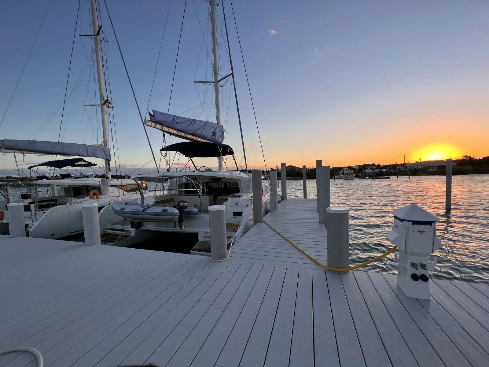 The AbacoSail dock at Conch Inn Marina at golden hour