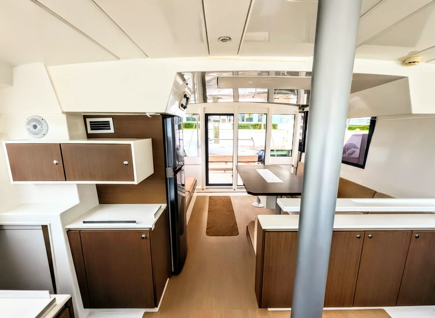 The saloon of Let's Geaux looking aft to the cockpit doors