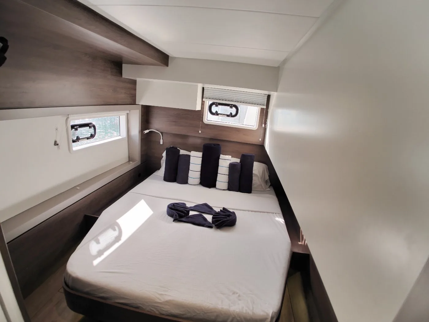 A double cabin aboard Ptarmigan with hull windows and turned-down berth