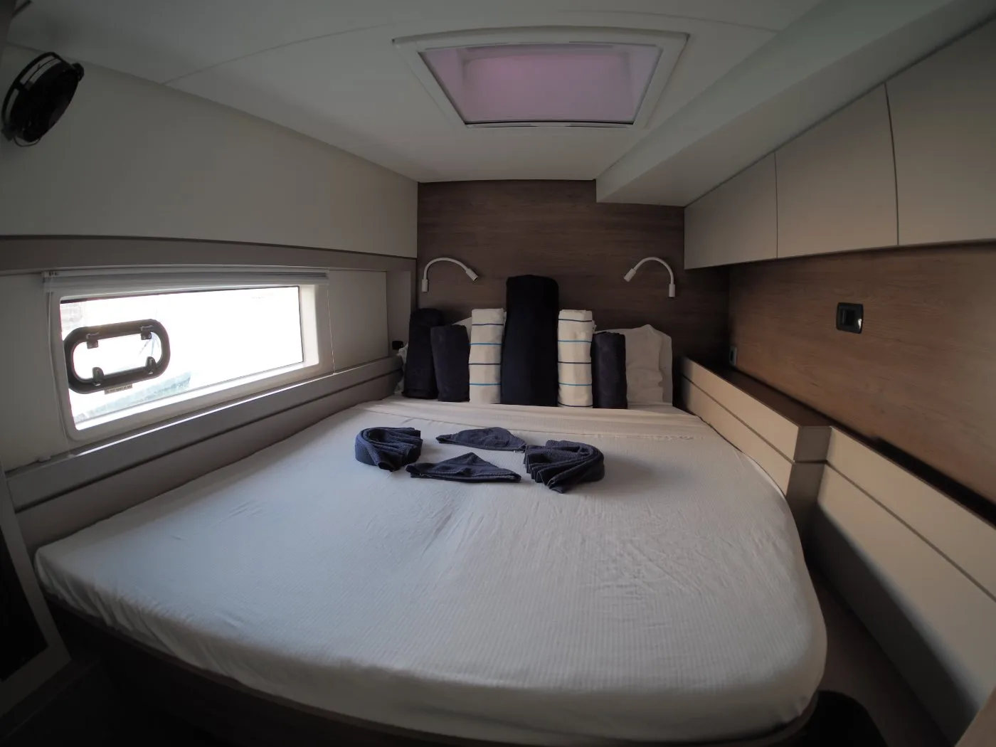 A second double cabin aboard Ptarmigan with reading lights and hull window