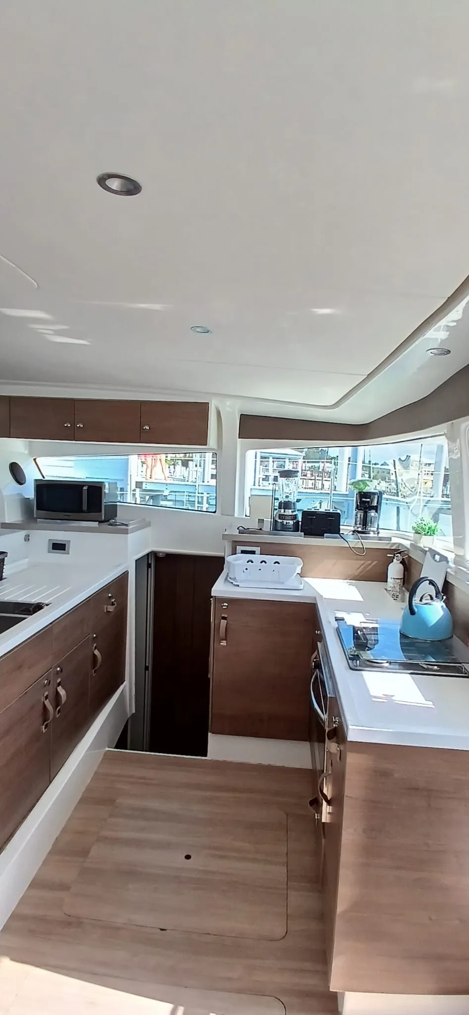 The galley aboard Uncharted with full-size fridge and three-burner stove