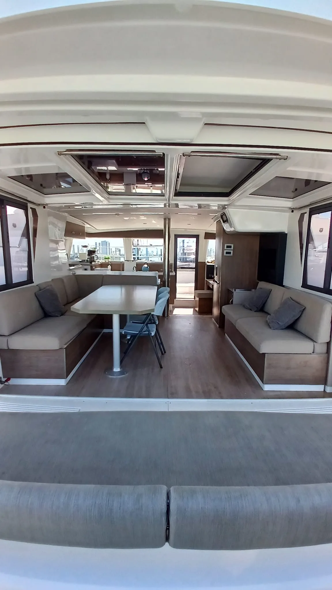 The saloon and galley of Uncharted, opening aft to the cockpit